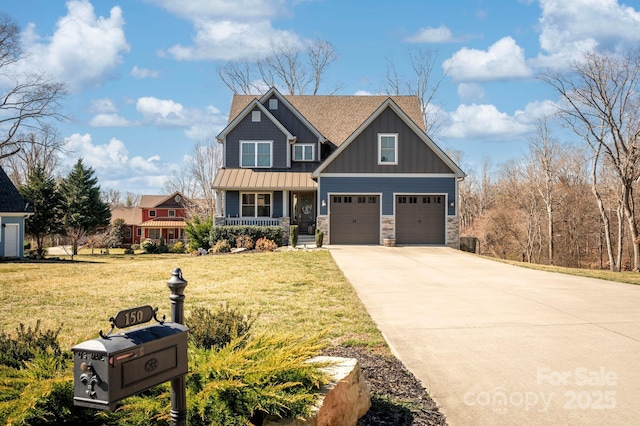 craftsman house with a standing seam roof, covered porch, concrete driveway, a front lawn, and board and batten siding