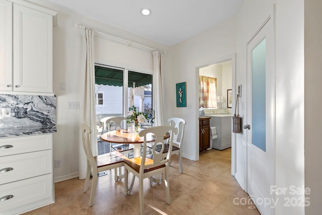 dining room featuring recessed lighting and baseboards