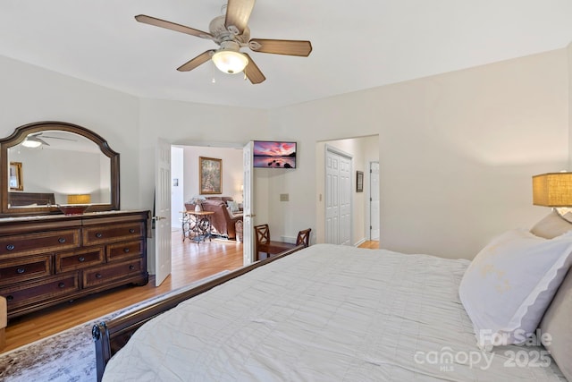 bedroom with ceiling fan and wood finished floors