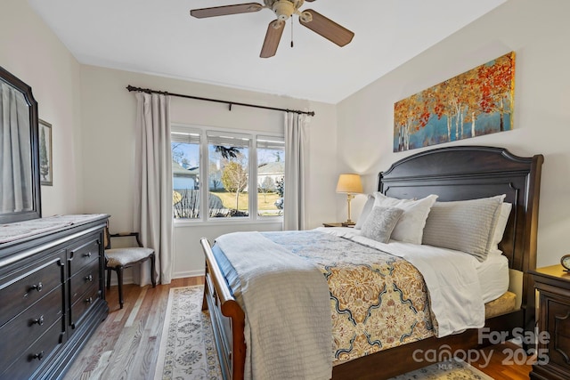 bedroom featuring a ceiling fan and wood finished floors