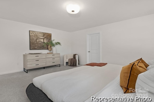 bedroom with light carpet and baseboards