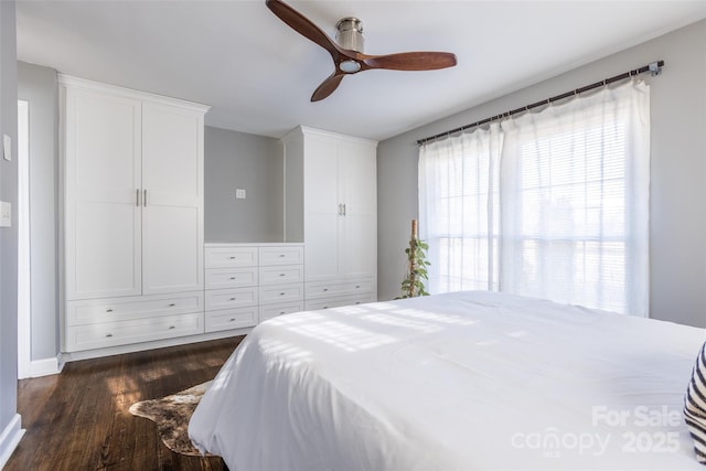 bedroom featuring dark wood-style floors and ceiling fan