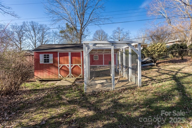 view of poultry coop with a yard