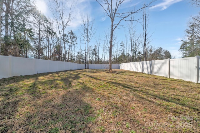 view of yard with a fenced backyard