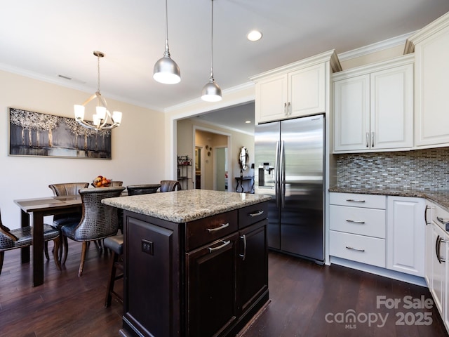 kitchen featuring dark wood-style floors, white cabinets, crown molding, and stainless steel fridge with ice dispenser