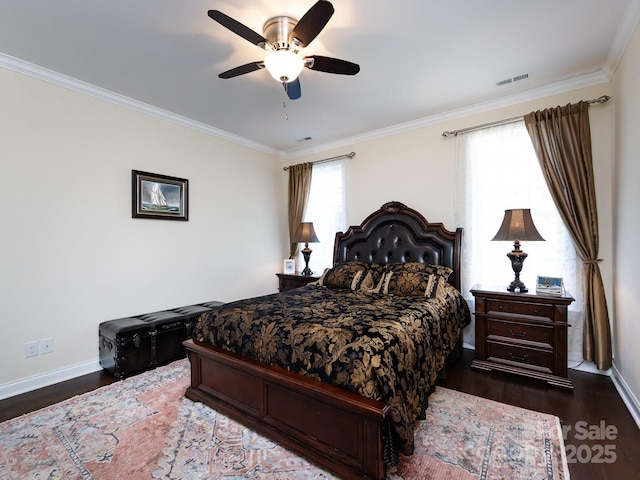 bedroom with baseboards, visible vents, wood finished floors, and ornamental molding