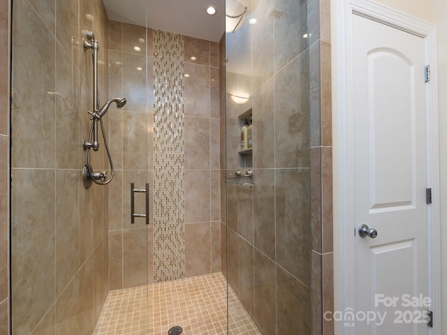 bathroom with a shower stall