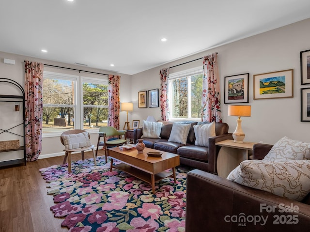 living area with recessed lighting, baseboards, and wood finished floors