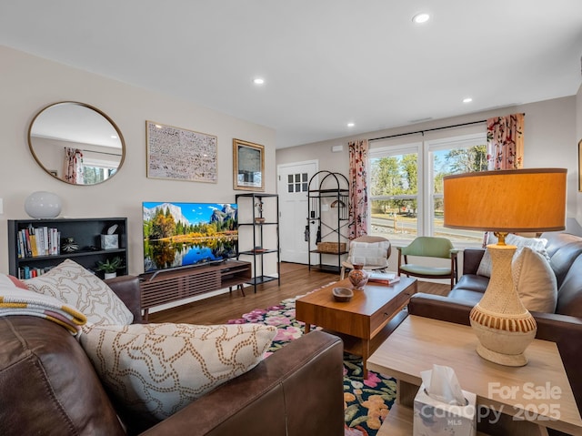 living room with recessed lighting and wood finished floors