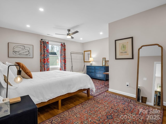 bedroom featuring ceiling fan, recessed lighting, wood finished floors, and baseboards