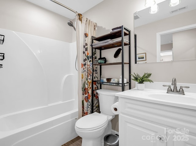 full bath with shower / bath combination with curtain, visible vents, vanity, and toilet