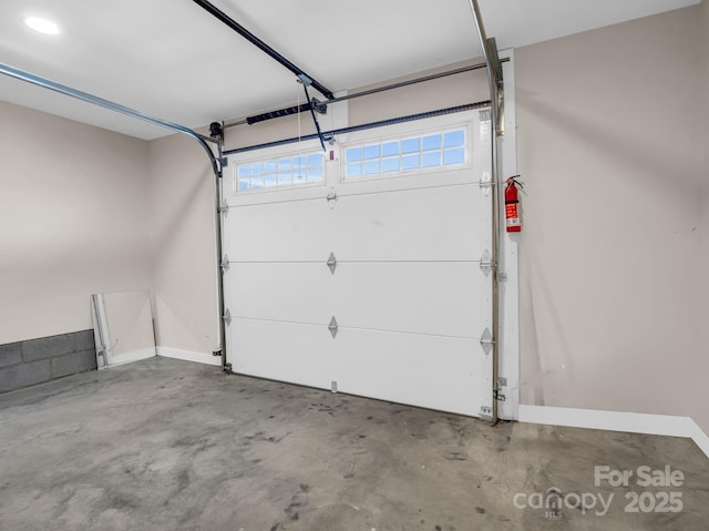 garage featuring baseboards