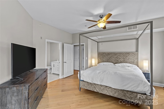 bedroom with connected bathroom, a ceiling fan, baseboards, visible vents, and light wood-style floors