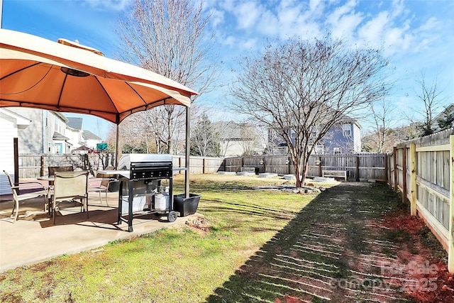 view of yard with a gazebo, a patio area, a fenced backyard, and a residential view