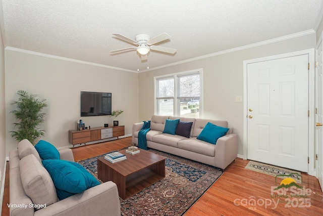 living room featuring crown molding, a textured ceiling, and wood finished floors