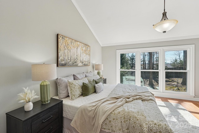 bedroom featuring vaulted ceiling and wood finished floors