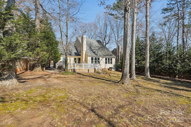 view of yard with fence and a deck