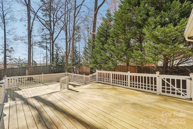 deck featuring a fenced backyard