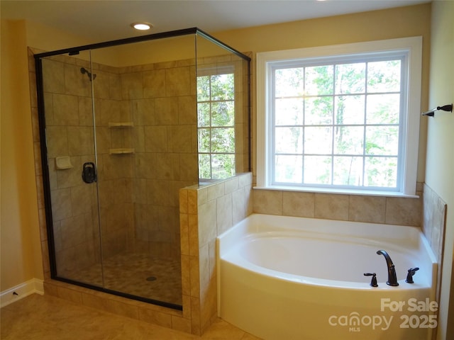 bathroom with a garden tub, recessed lighting, and a stall shower