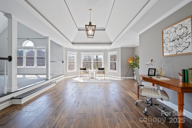 foyer featuring baseboards, a tray ceiling, dark wood-type flooring, and crown molding