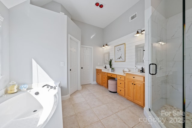 full bathroom featuring tile patterned flooring, vanity, visible vents, a marble finish shower, and a bath