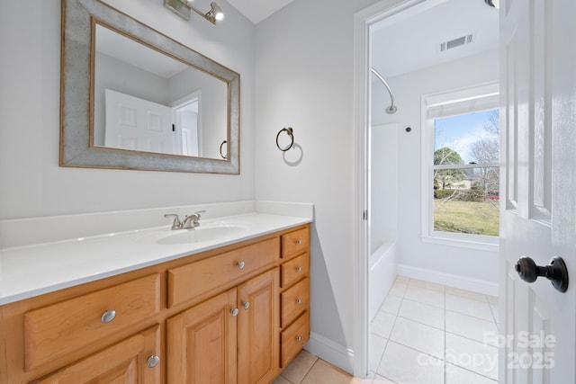 full bathroom with tile patterned flooring, bathing tub / shower combination, vanity, visible vents, and baseboards