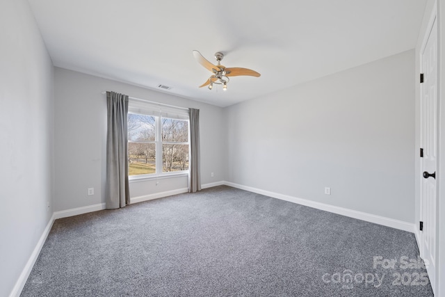 spare room featuring a ceiling fan, carpet flooring, visible vents, and baseboards