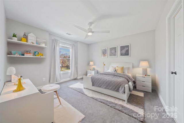 carpeted bedroom with ceiling fan, visible vents, and baseboards