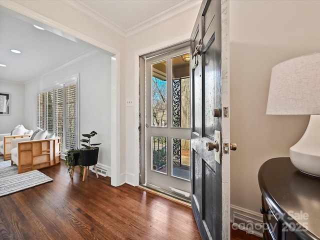 entrance foyer with ornamental molding, dark wood-type flooring, recessed lighting, and baseboards