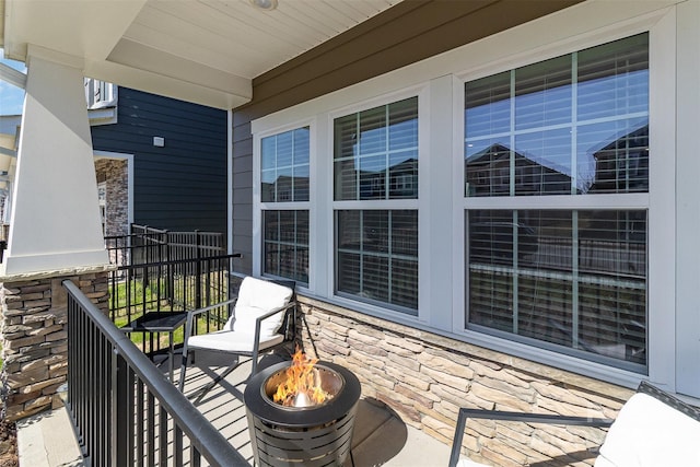 balcony with an outdoor fire pit