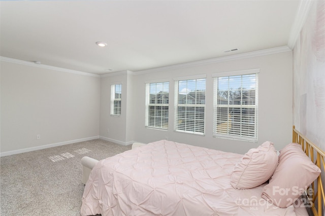 bedroom with baseboards, multiple windows, ornamental molding, and carpet flooring