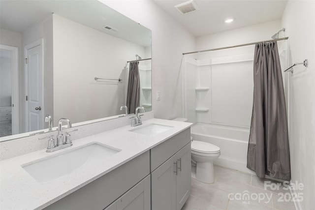 full bathroom with visible vents, a sink, and tile patterned floors