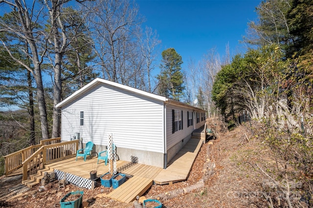 view of property exterior with a deck