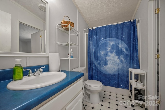 bathroom featuring toilet, curtained shower, a textured ceiling, and vanity