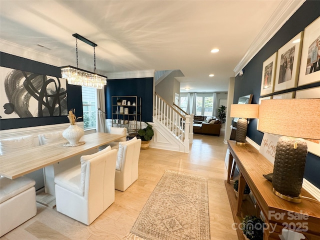 dining space with stairway, crown molding, and recessed lighting