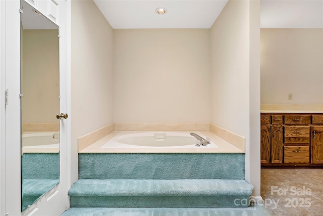 bathroom with a garden tub