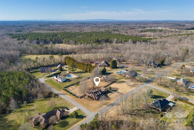 aerial view featuring a rural view and a view of trees