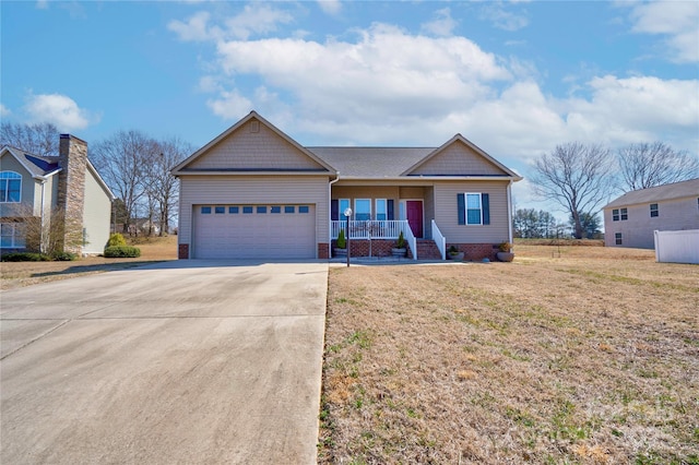 view of front facade featuring covered porch, driveway, a front lawn, and an attached garage