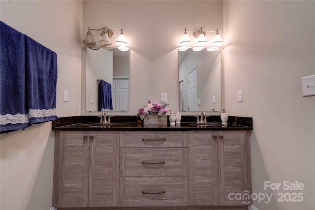 bathroom with double vanity and a sink