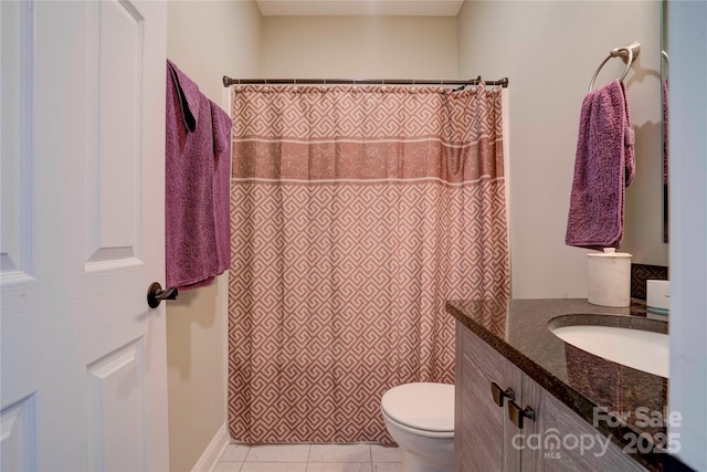 bathroom featuring toilet, tile patterned flooring, a shower with shower curtain, and vanity