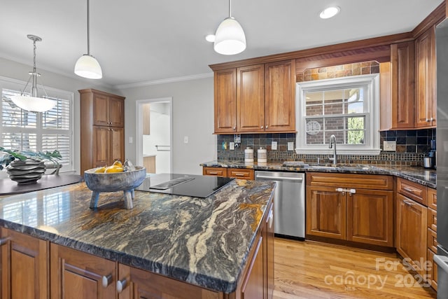 kitchen featuring crown molding, black electric stovetop, brown cabinetry, a sink, and dishwasher