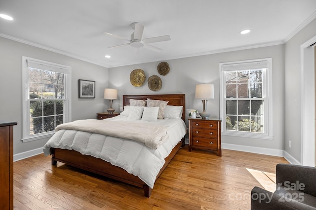 bedroom featuring multiple windows, crown molding, and wood finished floors