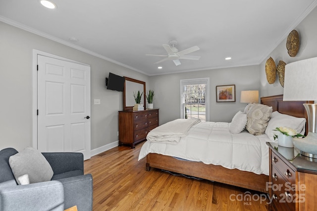 bedroom with light wood-style flooring, ornamental molding, baseboards, and recessed lighting