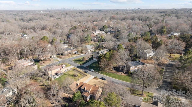 bird's eye view featuring a view of trees