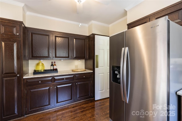 kitchen with crown molding, dark wood-style flooring, dark brown cabinetry, and stainless steel fridge with ice dispenser