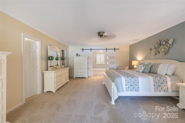 bedroom featuring a barn door, ornamental molding, baseboards, and light colored carpet