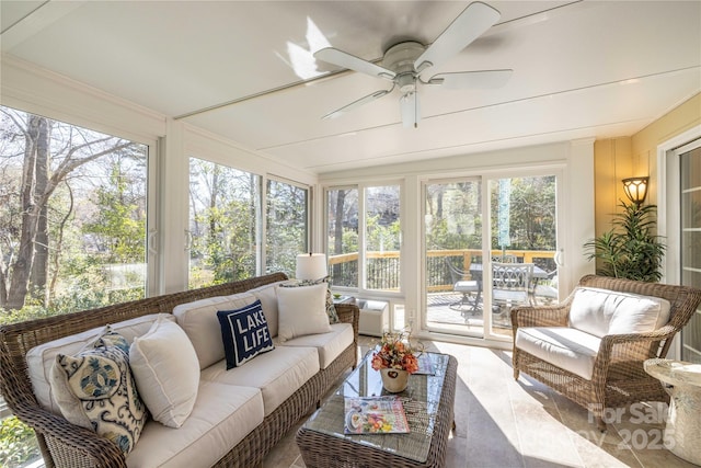 sunroom / solarium featuring ceiling fan