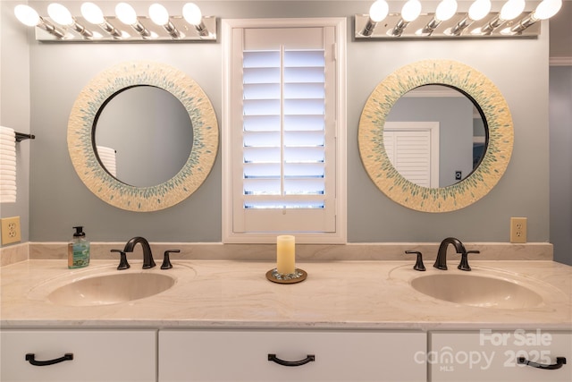 full bath featuring a sink and double vanity