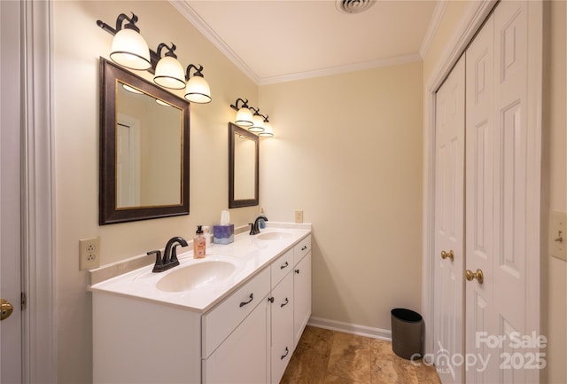 bathroom featuring crown molding, a sink, baseboards, and double vanity