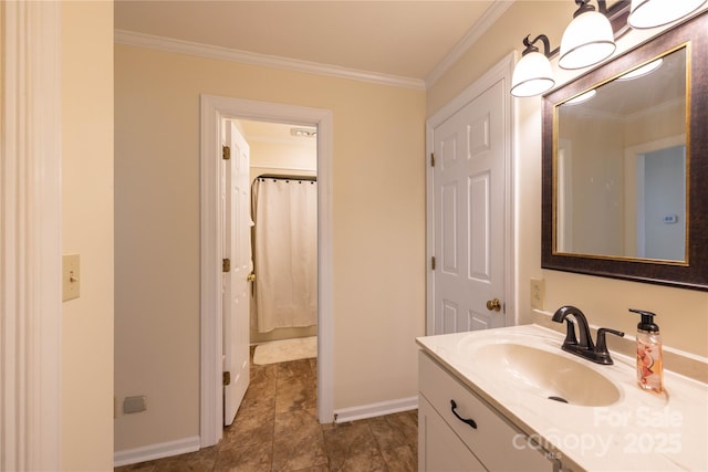 full bath featuring baseboards, ornamental molding, and vanity